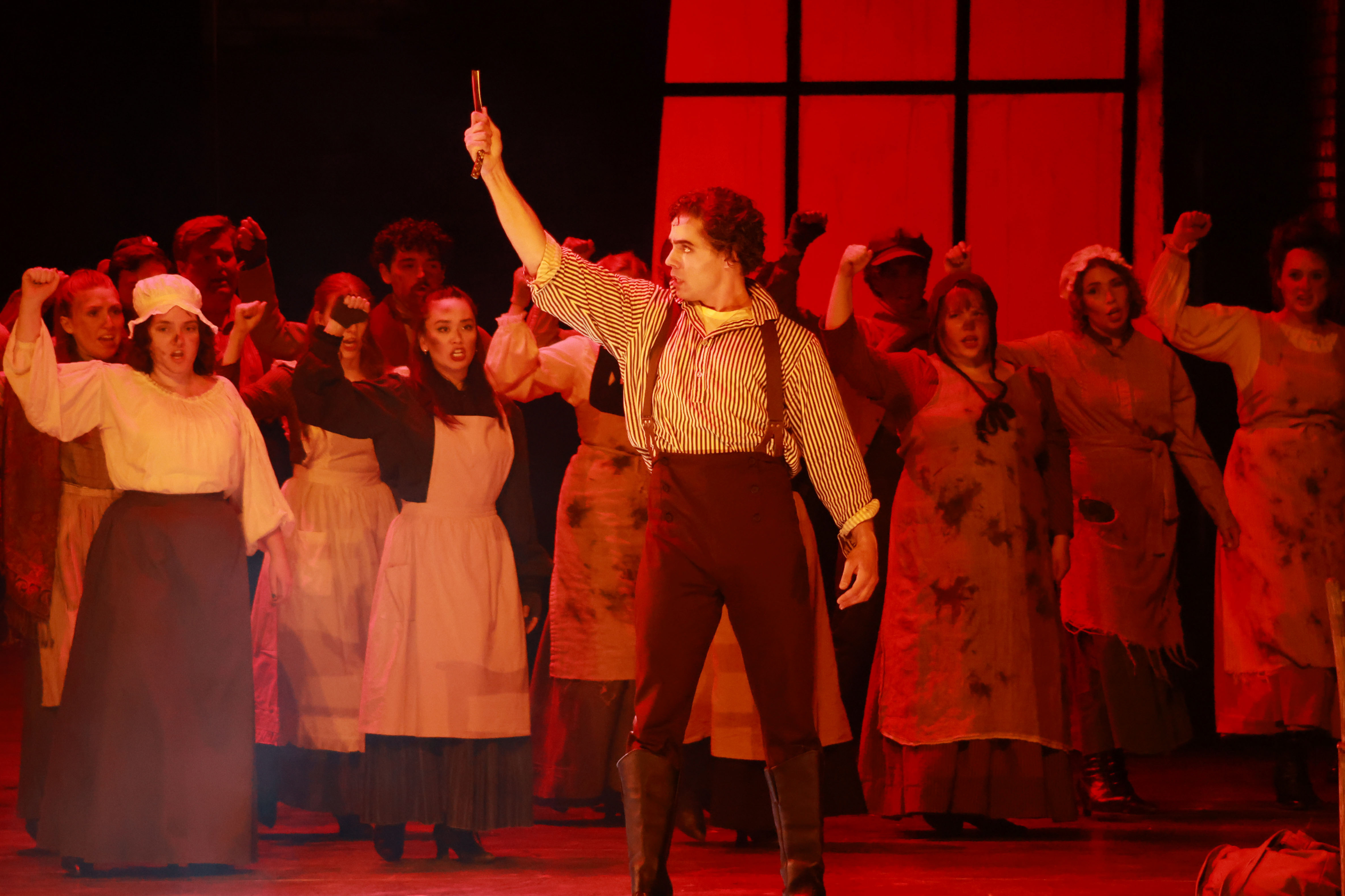 Baritone Skyler Schlenker (Sweeney Todd) and members of the chorus in in "Sweeney Todd: The Demon Barber of Fleet Street"