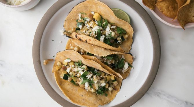 Calbacita tacos on white plate on table