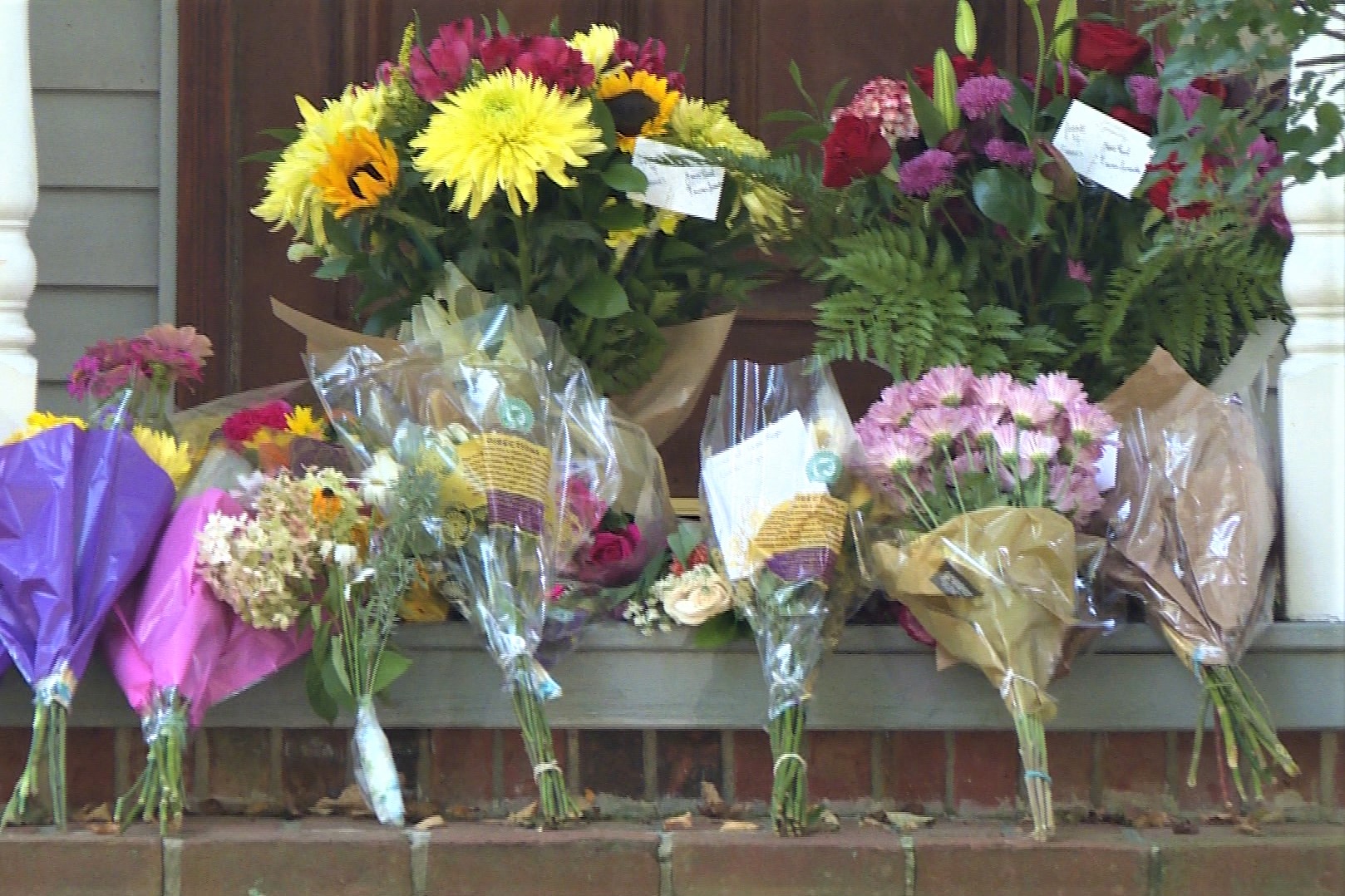 Flowers sit on the front steps of the Mumper family home in Bloomington.