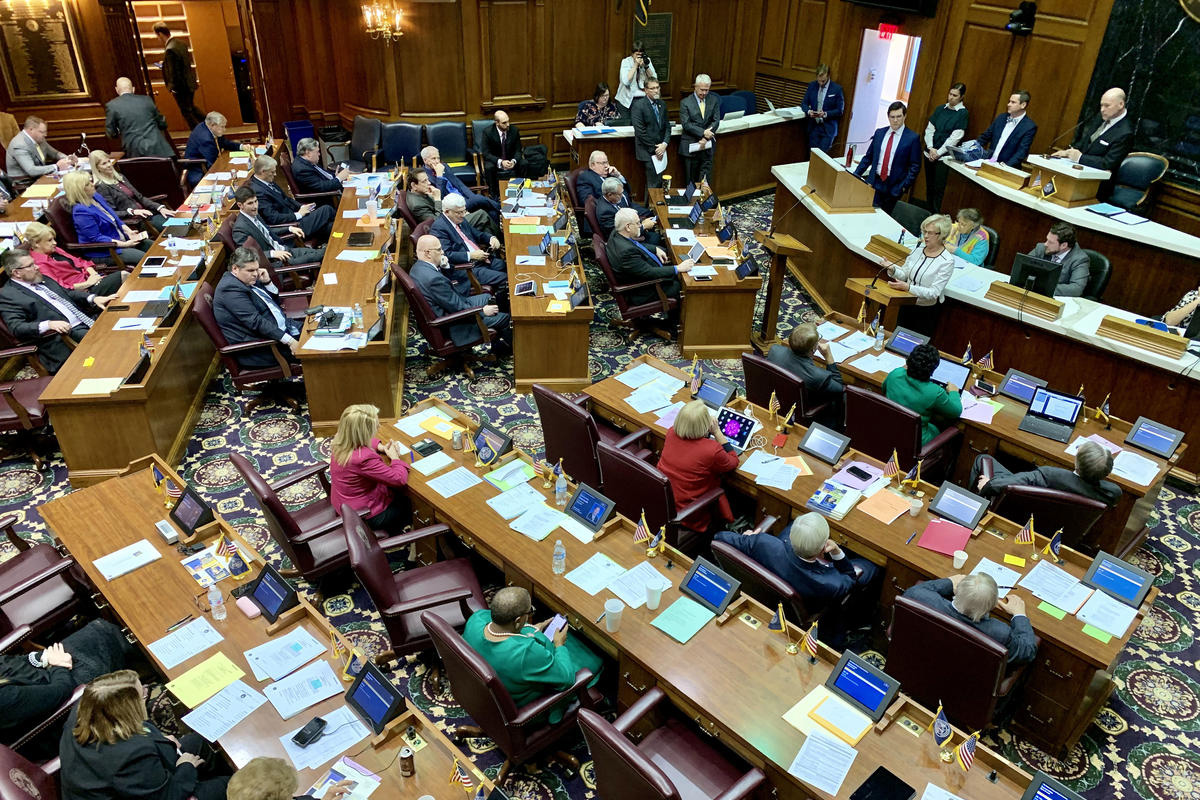 Lawmakers seated in the indiana house chambers in an aerial view
