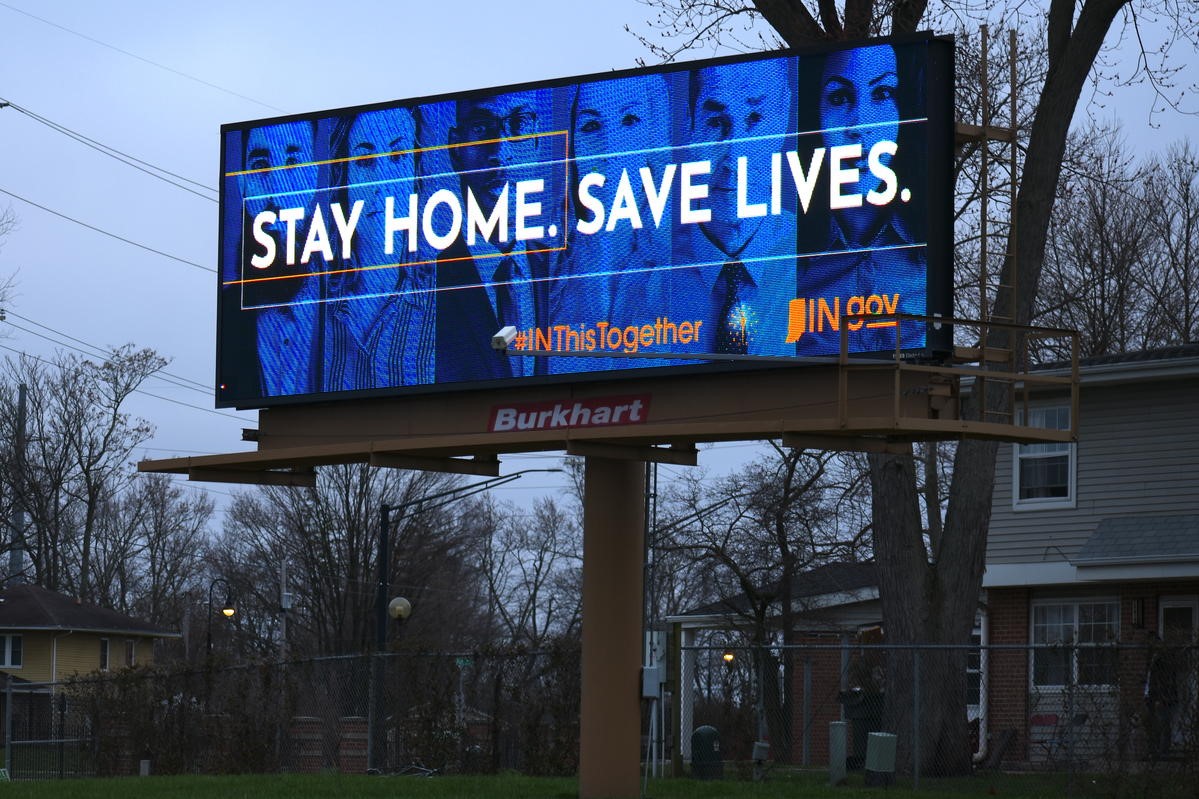 A billboard advertising social distancing.