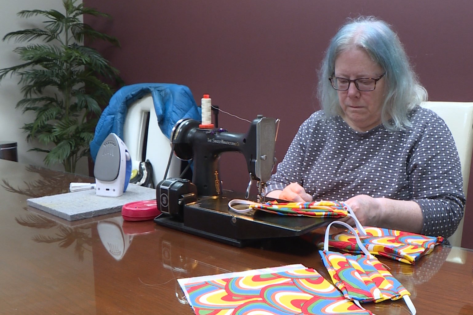 woman sewing mask