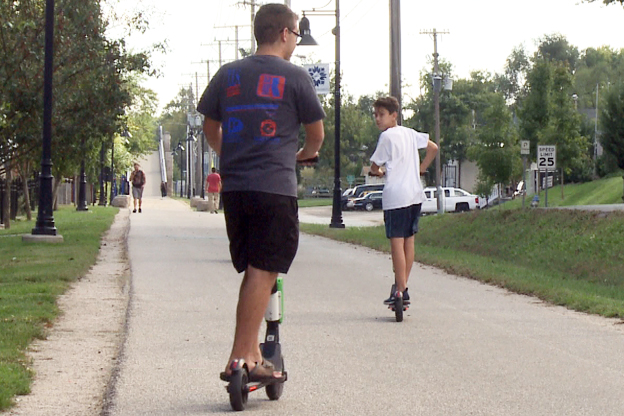 Scooter riders travel down the B-line trail. 