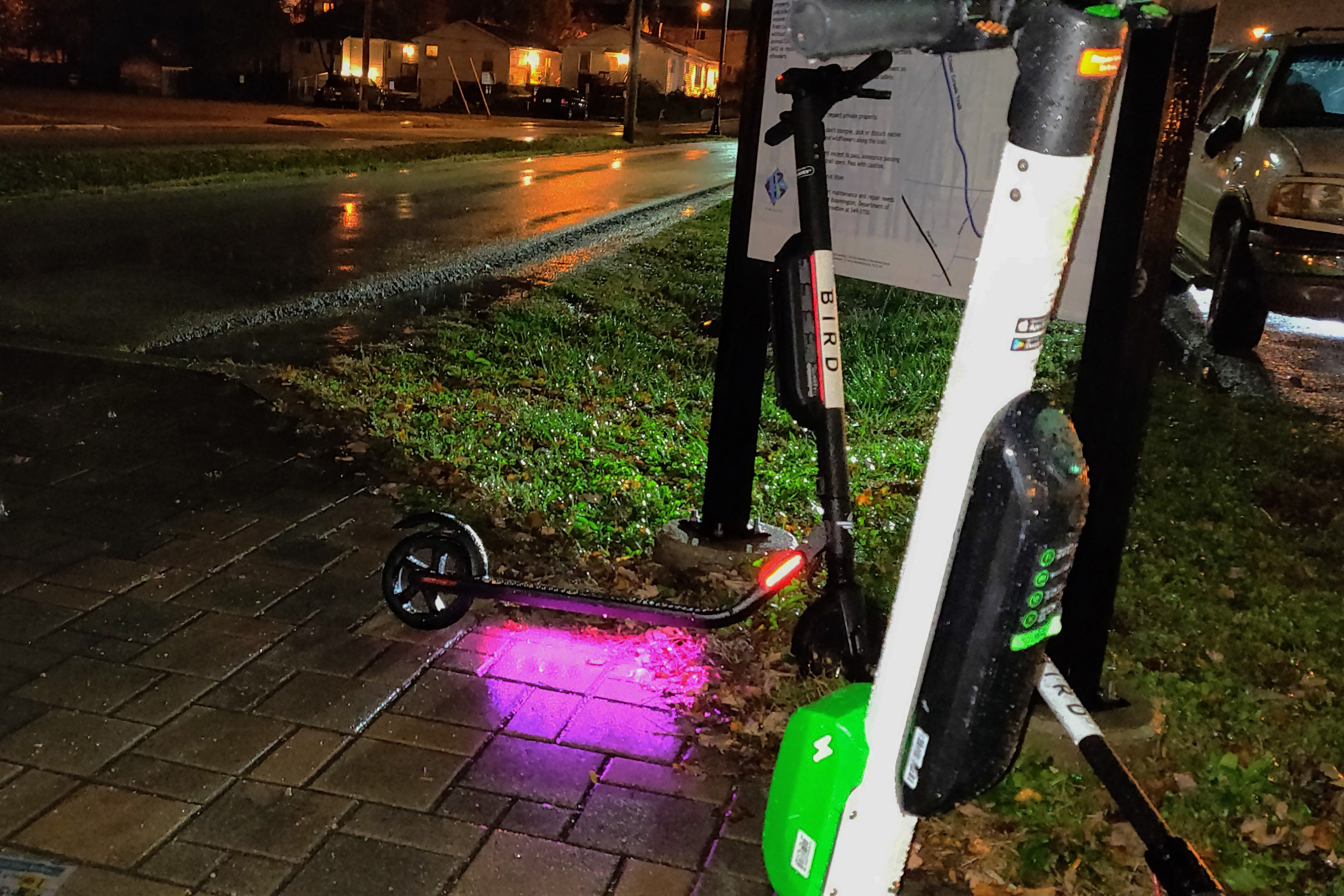 Two electric scooters on the streets in Bloomington.