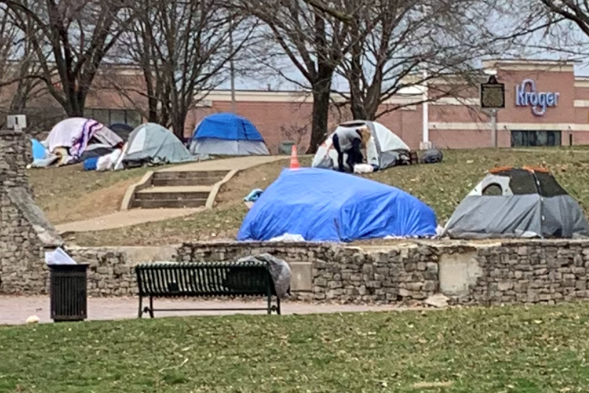 A photo of tents and overnight camping in Bloomington's Seminary Park.