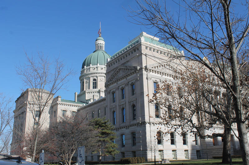 Indiana statehouse in spring with a blue sky