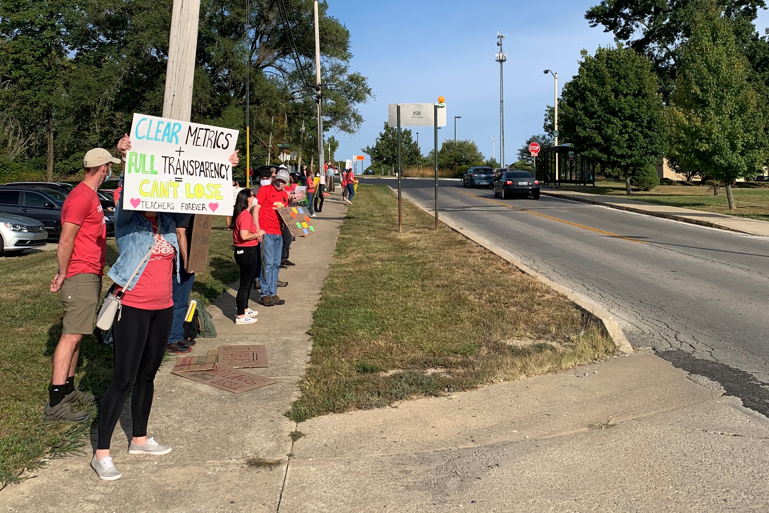 A photo of parents and teachers rallying outside MCCSC buildings.