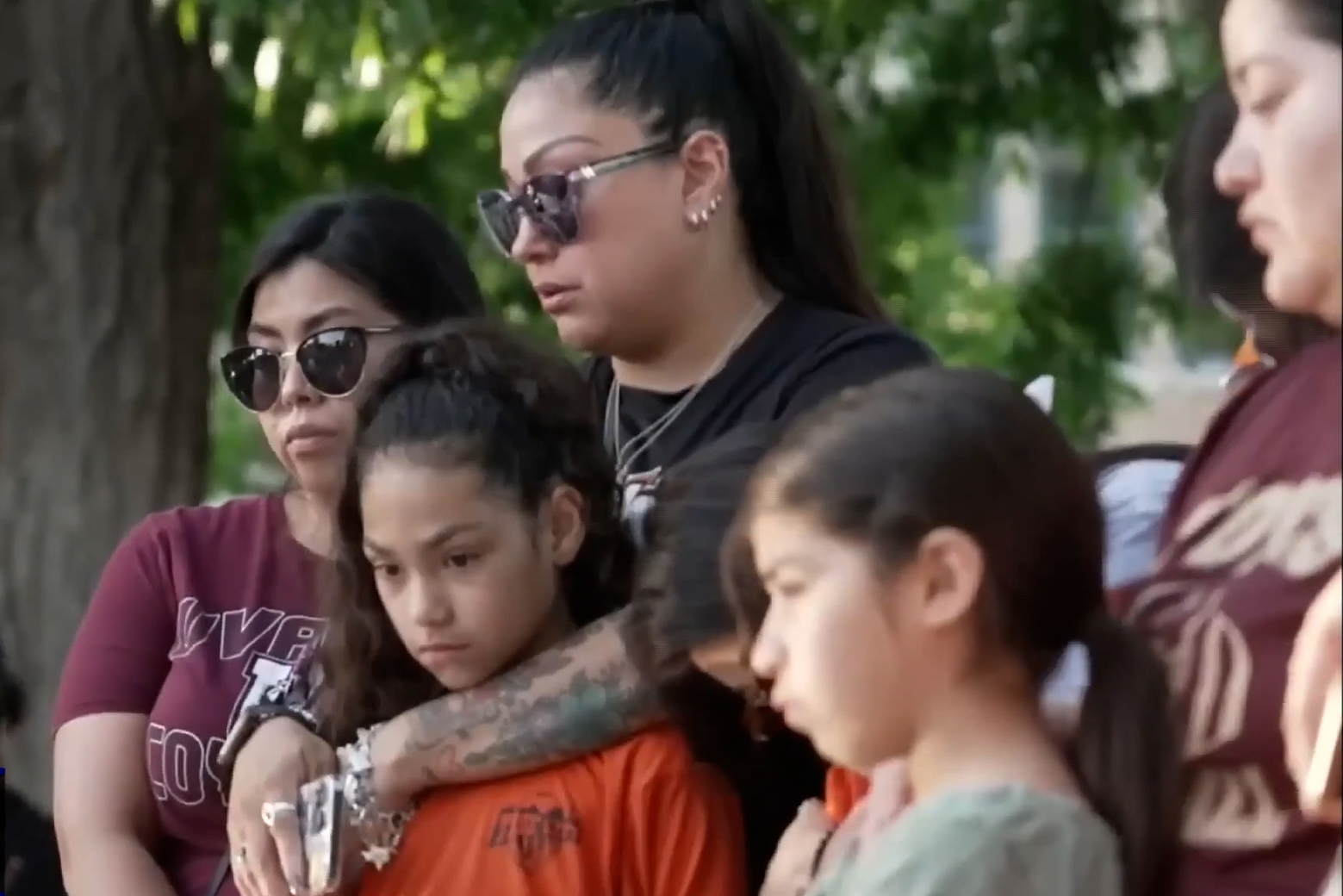 Parents and children gather outside Robb Elementary School in Uvalde, Texas