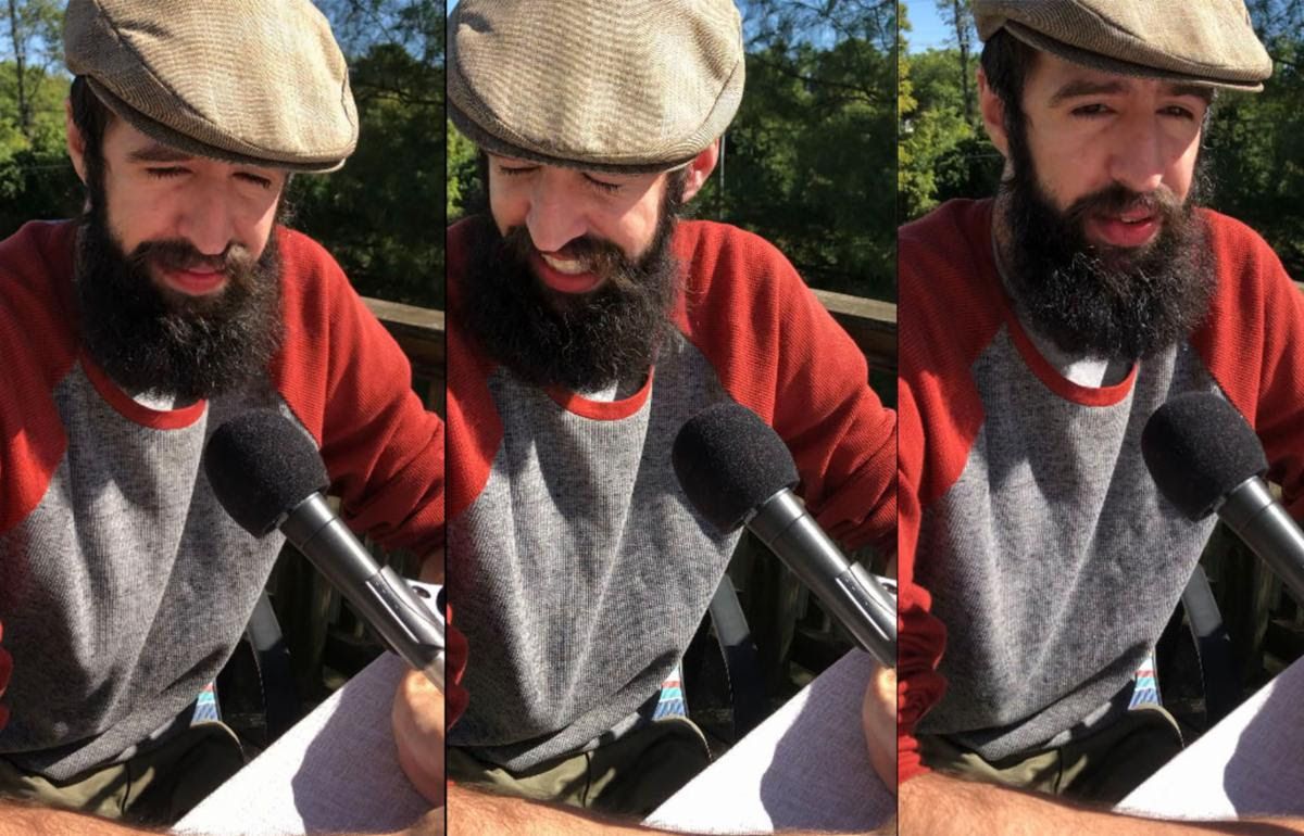 Three successive images of a bearded man's face, wincing. He is wearing a tweed hat, and there is a mic in front of him. 