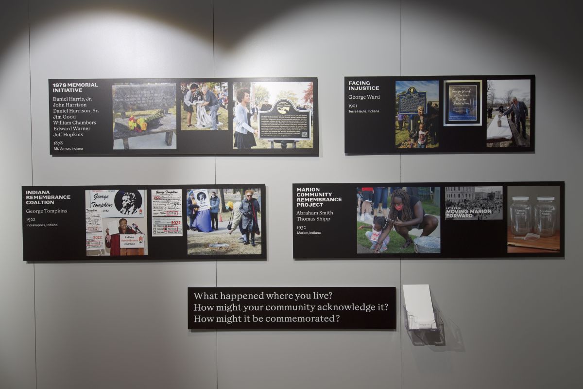 A display of 4 panels with photos of community remembrance projects