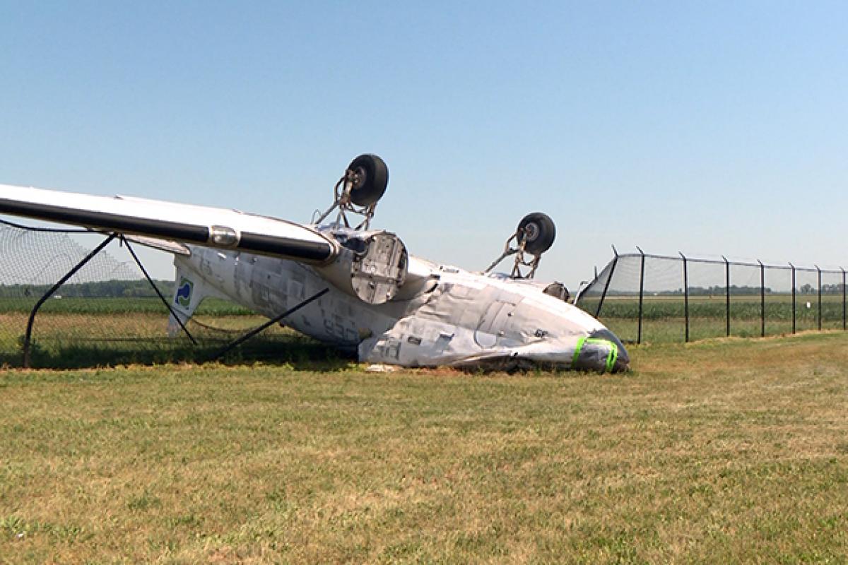 Image of overturned DC3 plane at Columbus Municipal Airport.