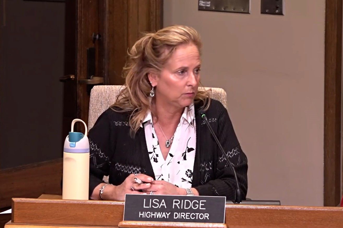 Highway Director Lisa Ridge discusses road pavement project.