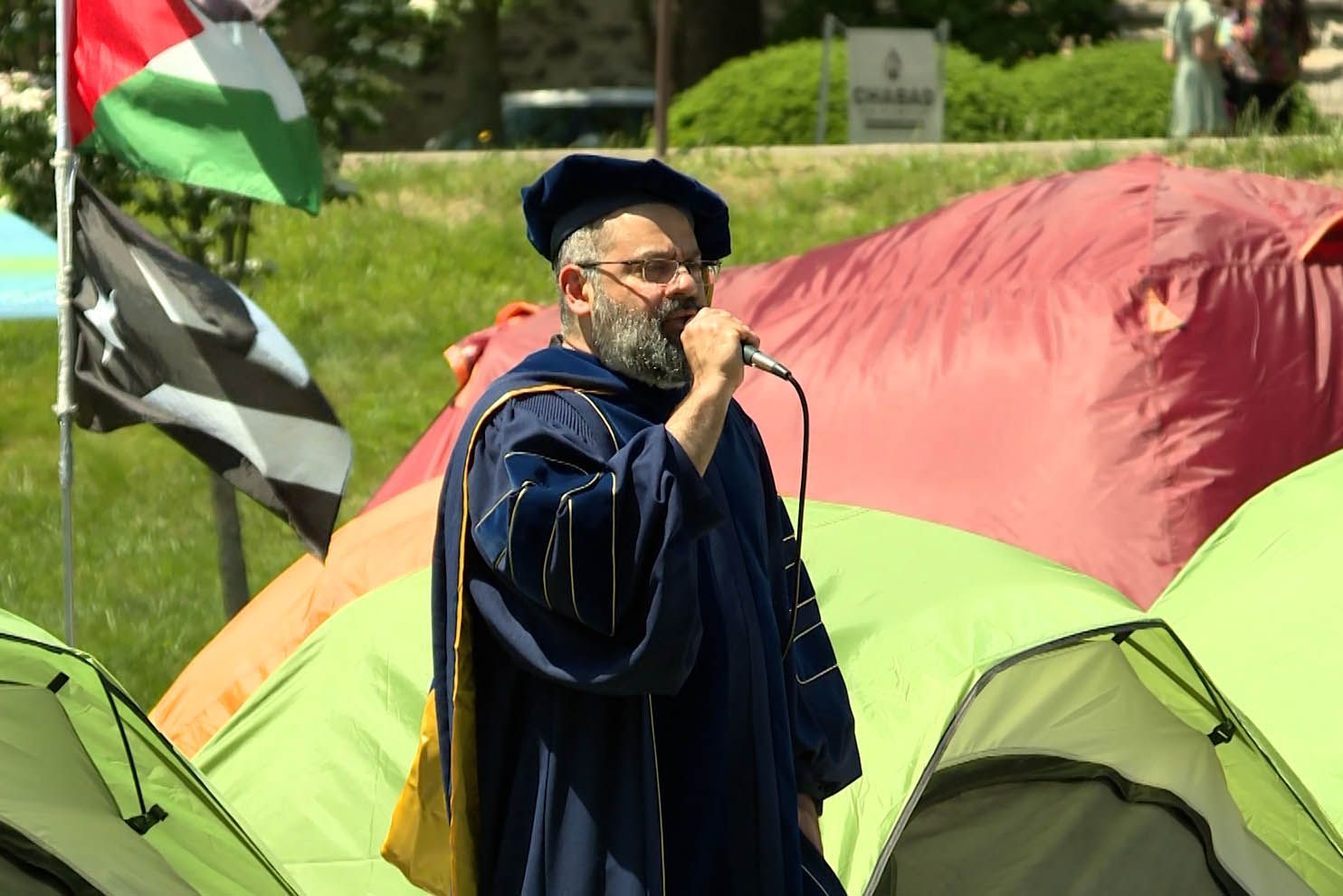 IU professor Abdulkhader Sinnon speaks in Dunn Meadow Saturday during what was billed as an alternative commencement.