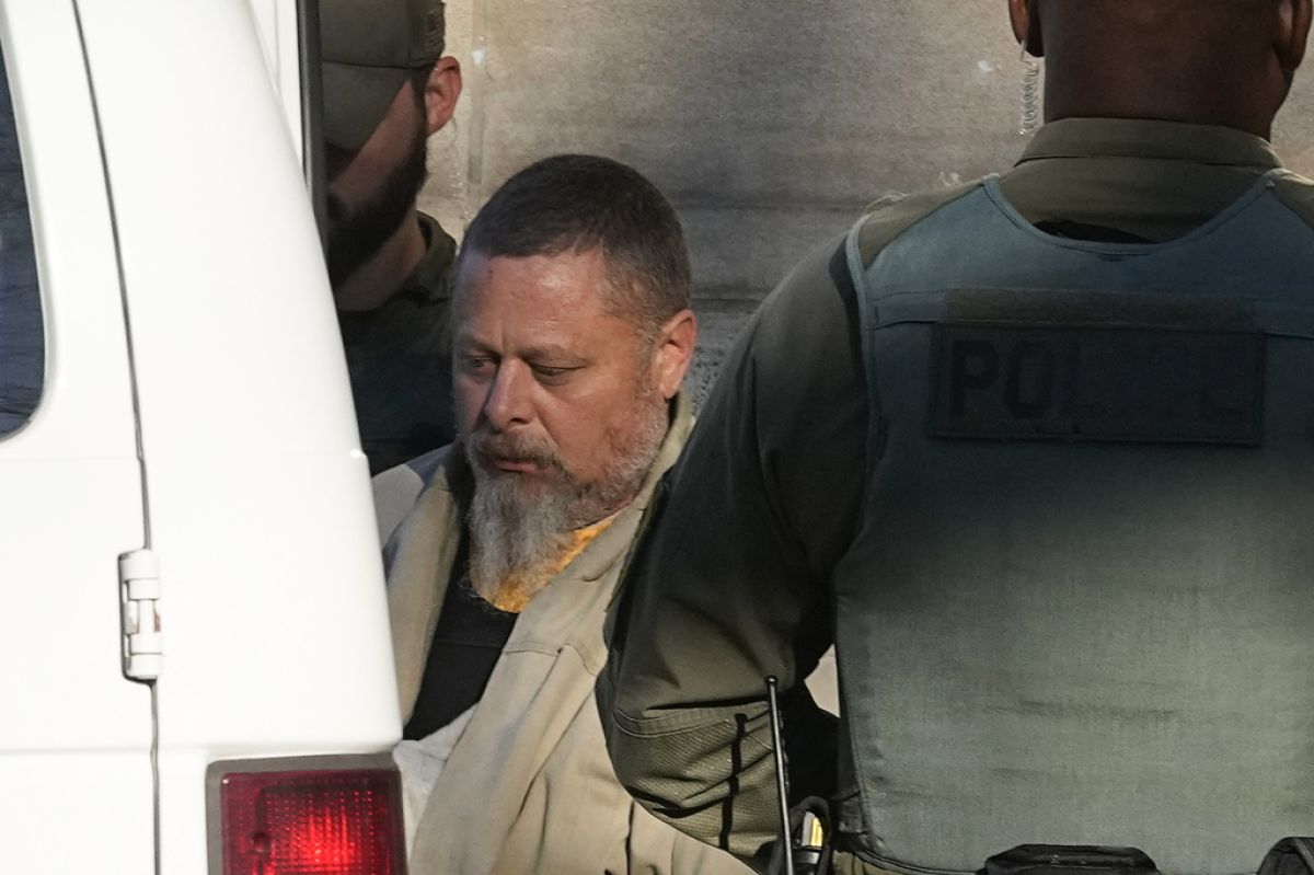 AP OK TO USE Officers escort Richard Allen out of the Carroll County courthouse following a hearing, Nov. 22, 2022, in Delphi, Ind. 