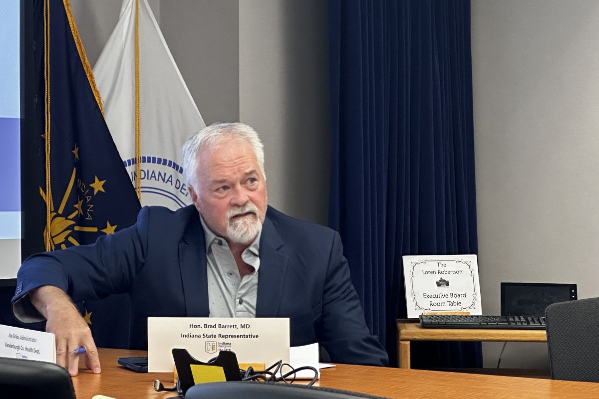 Representative Brad Barrett speaks at a meeting in a conference room at the Indiana Department of Health. 