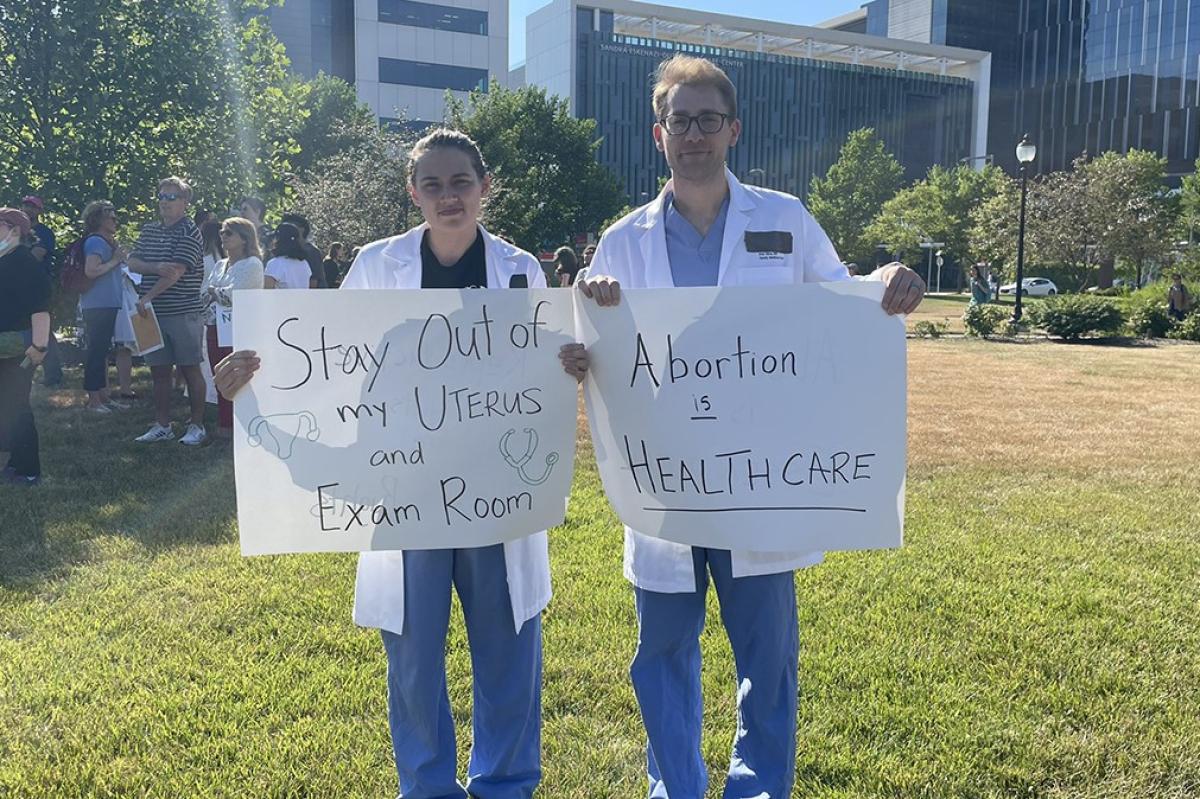 doctors with abortion signs
