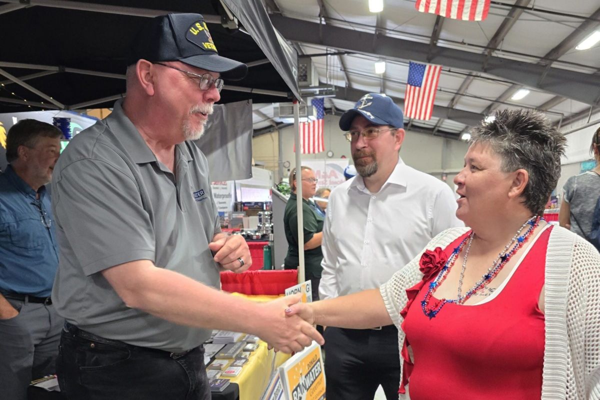 Libertarian gubernatorial candidate Donald Rainwater talks with supporters.