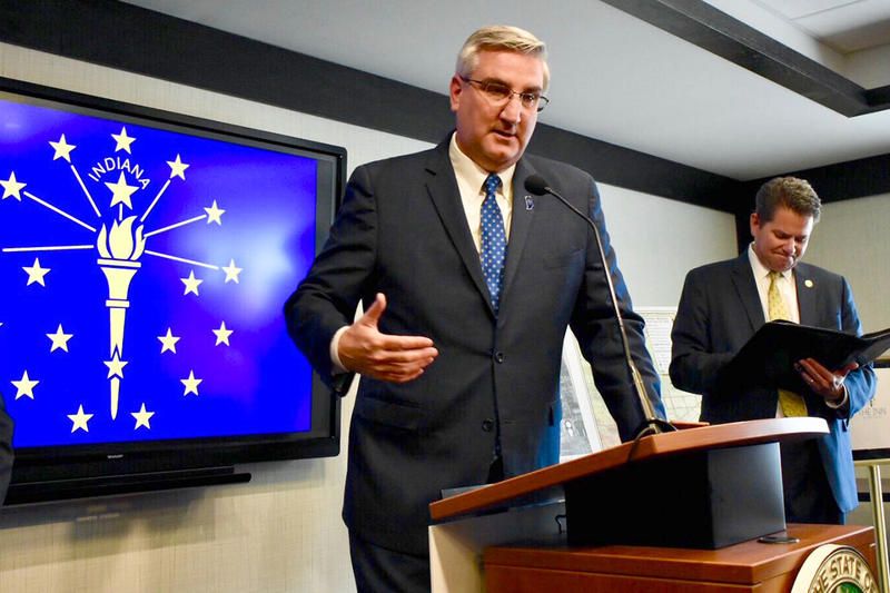 Gov. Eric Holcomb at a podium. 