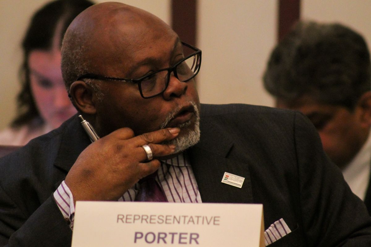 Representative Greg Porter sits in the House Ways and Means Committee room.