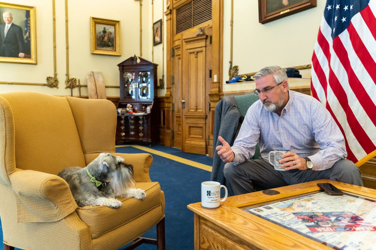 Gov. Eric Holcomb with First Dog Henry Holcomb in his Statehouse office.
