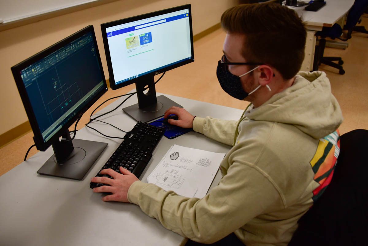 young man at computer desk