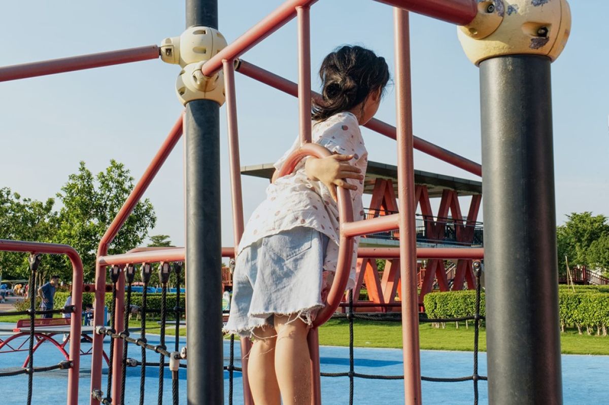 kid on playground equipment