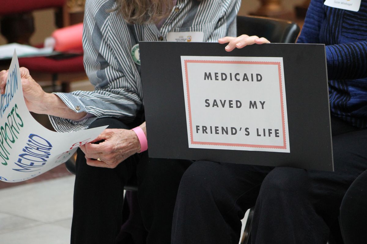 sign that says medicaid save my friends life