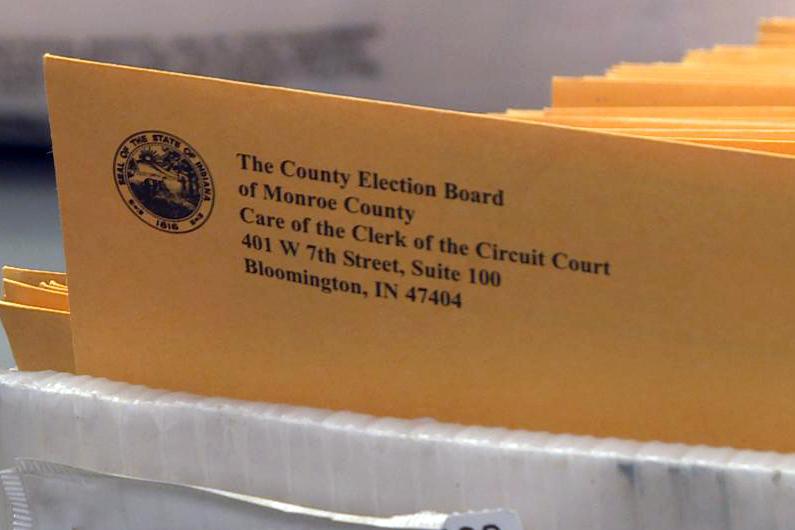An image of blank absentee ballots ready to be mailed out to voters.