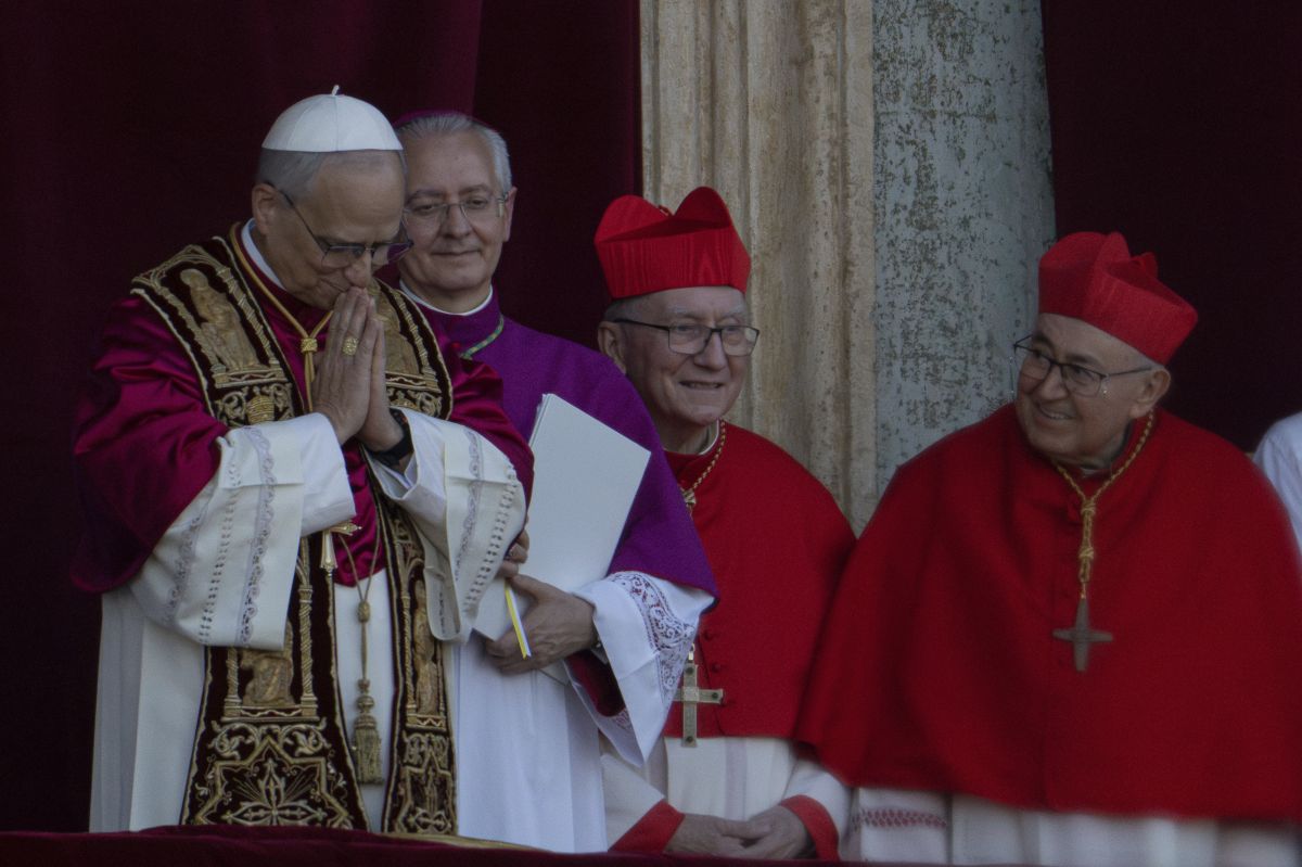 AP OK - Newly elected Pope Leo XIV, left, formerly Cardinal Robert Francis Prevost, appears (left) at the Vatican shortly after his election as the 267th pontiff of the Roman Catholic Church, Thursday, May 8, 2025.