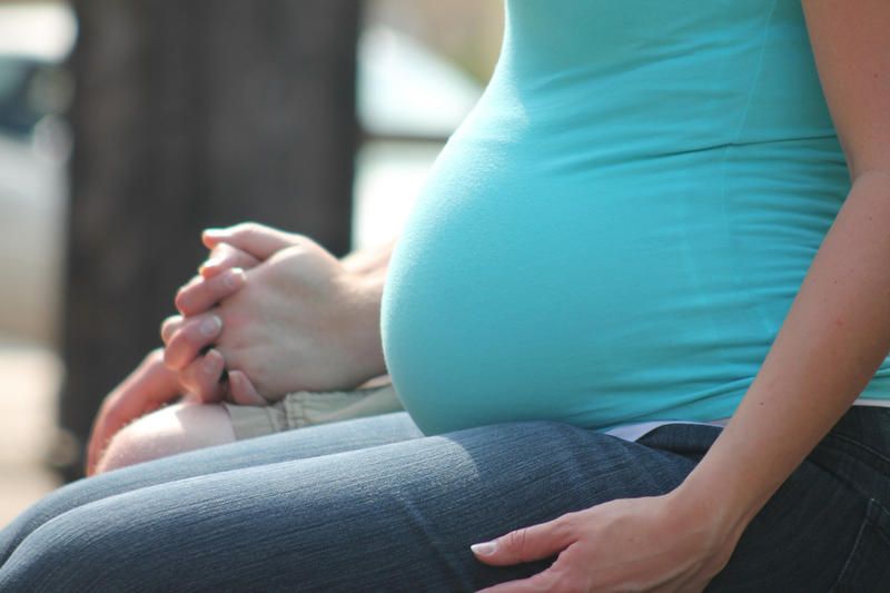 pregnant lclose-up outside