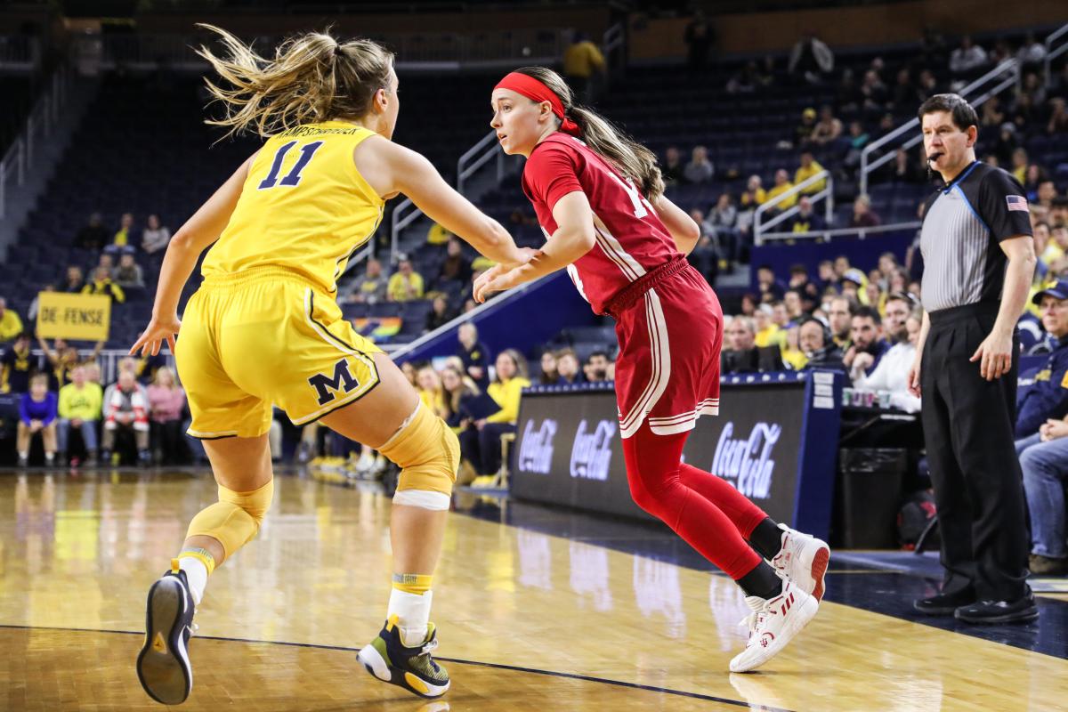 Indiana's Sara Scalia dribbles against Michigan's Greta Kampshroeder during Monday night's game in Ann Arbor, Mich.