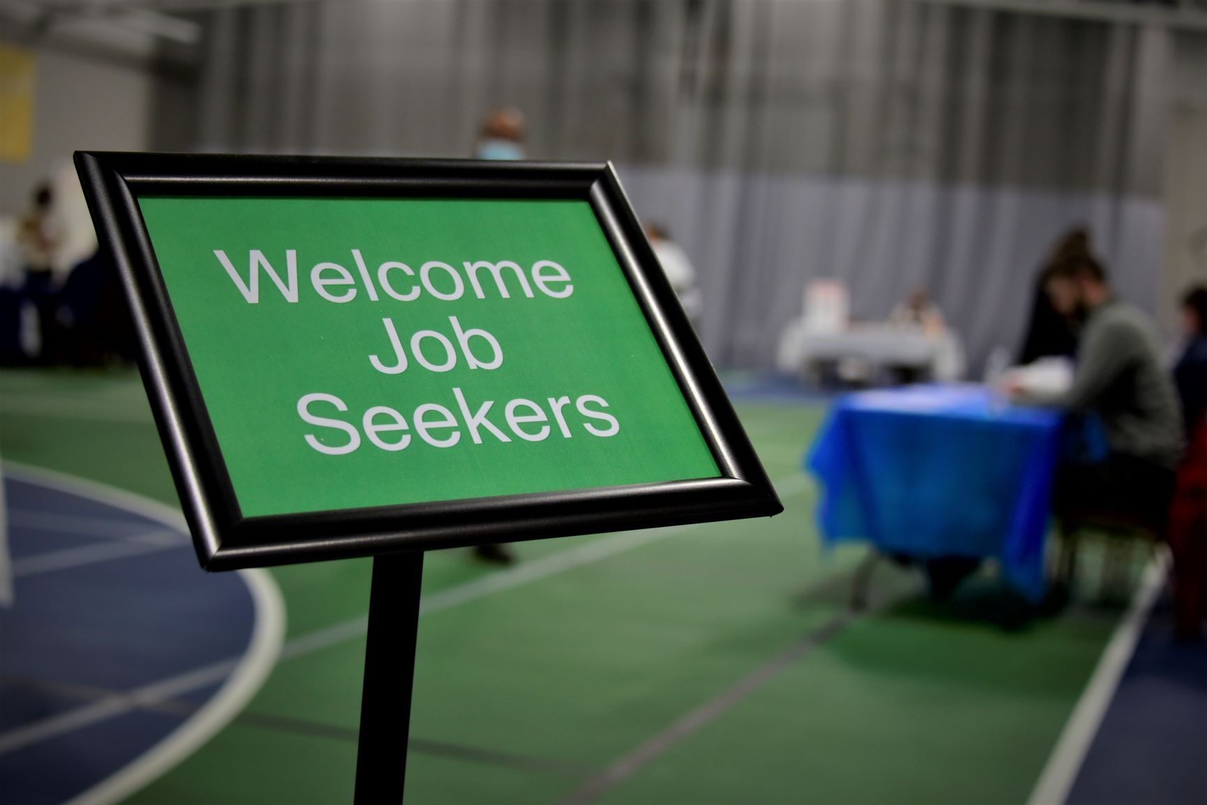 sign that reads now hiring