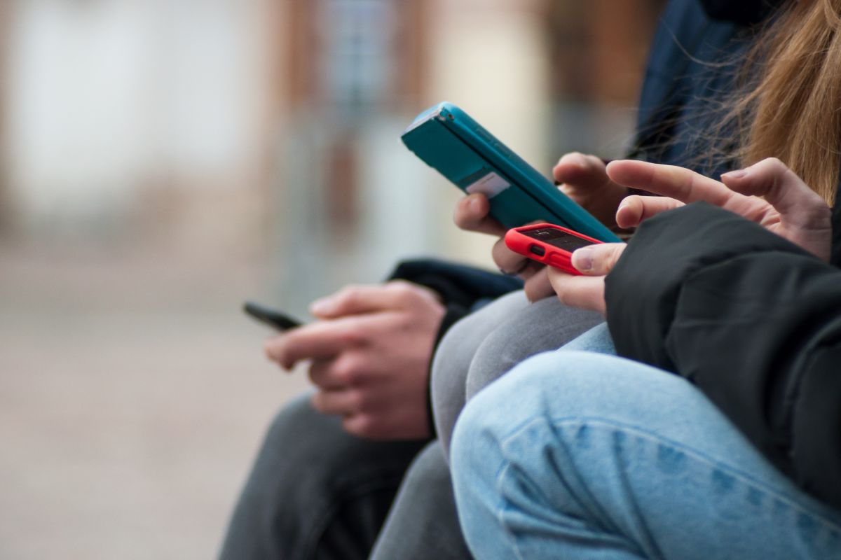 closeup of teenagers on smartphone