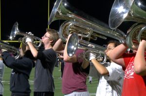 The Bloomington Cougars horn line plays at a rehearsal on Oct. 24, 2023.
