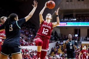 Indiana&amp;amp;apos;s C.J. Gunn shoots against Michigan during Tuesday night&amp;amp;apos;s game in Ann Arbor, Mich.