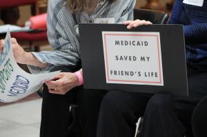sign that says medicaid save my friends life