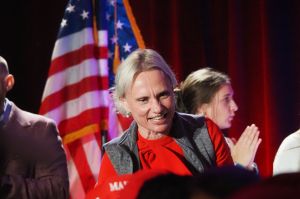 U.S. Senate hopeful John Rust and his attorney, Michelle Harter, appear before the Indiana Election Commission on Tuesday, Feb. 27, 2024, in Indianapolis.